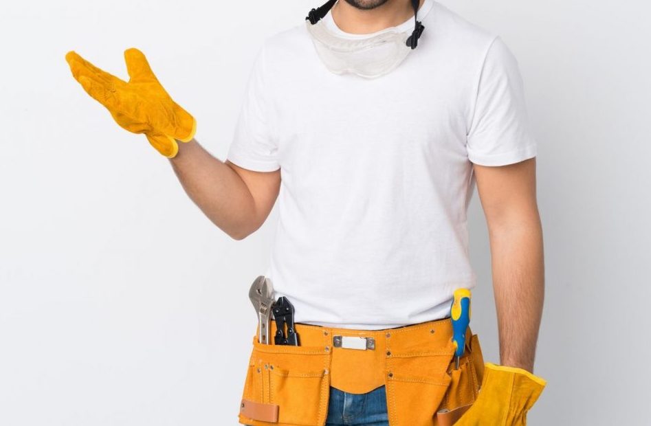Craftsmen or electrician man over isolated white background holding copyspace imaginary on the palm